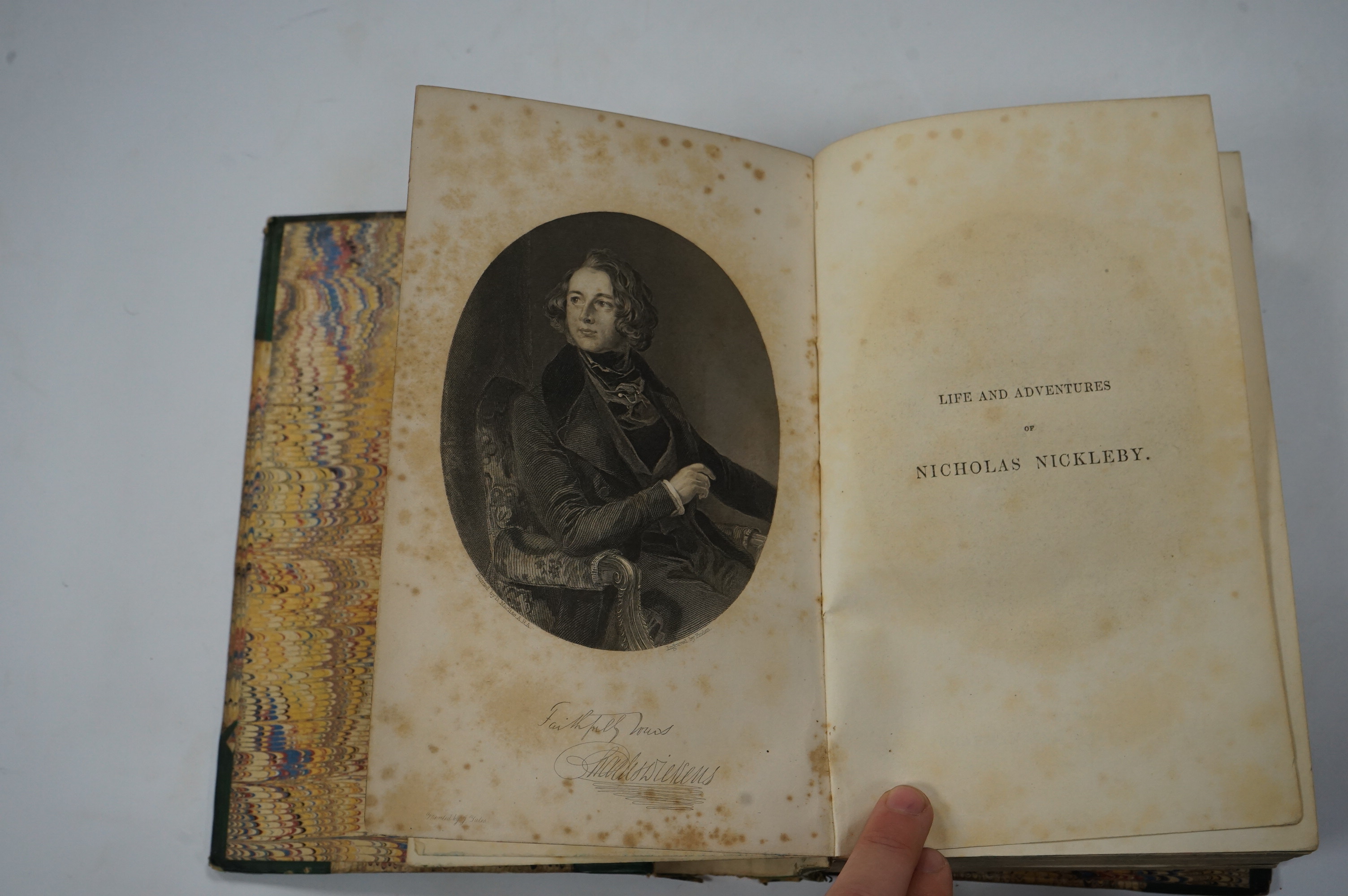 Dickens, Charles - The Life and Adventures of Nicholas Nickleby. First Edition. portrait frontis. of the author, 39 plates (by Phiz, i.e. H.K. Browne); near contemp. half calf and marbled boards, gilt decorated and panel